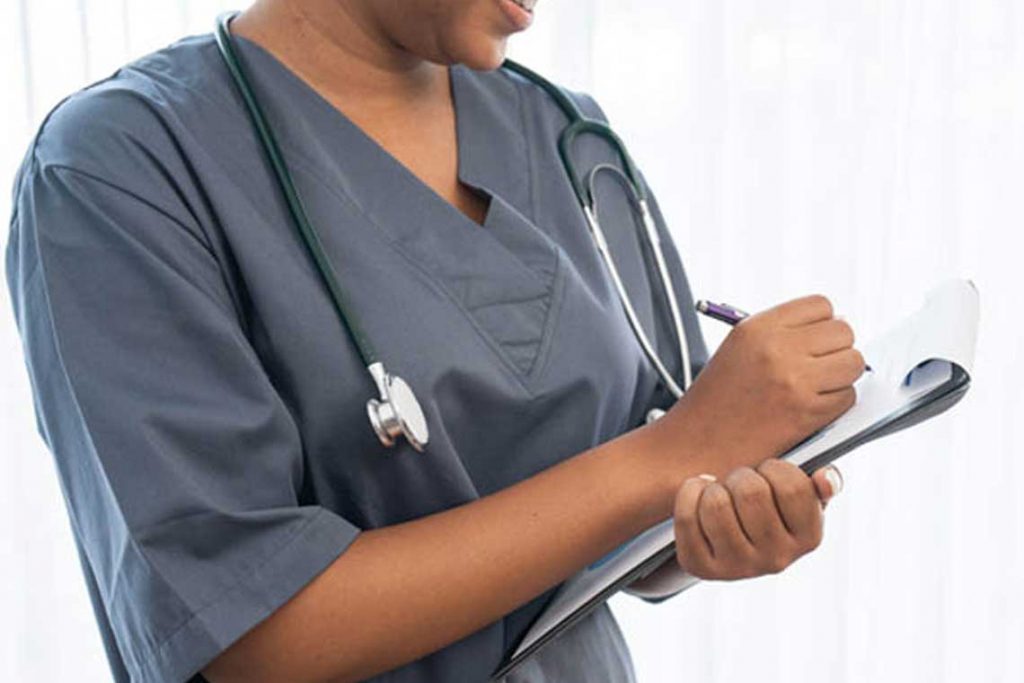 nurse holding patient chart