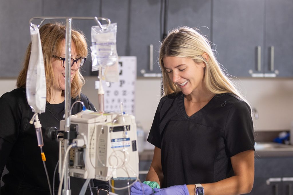 harding nursing student practicing with fluid bags